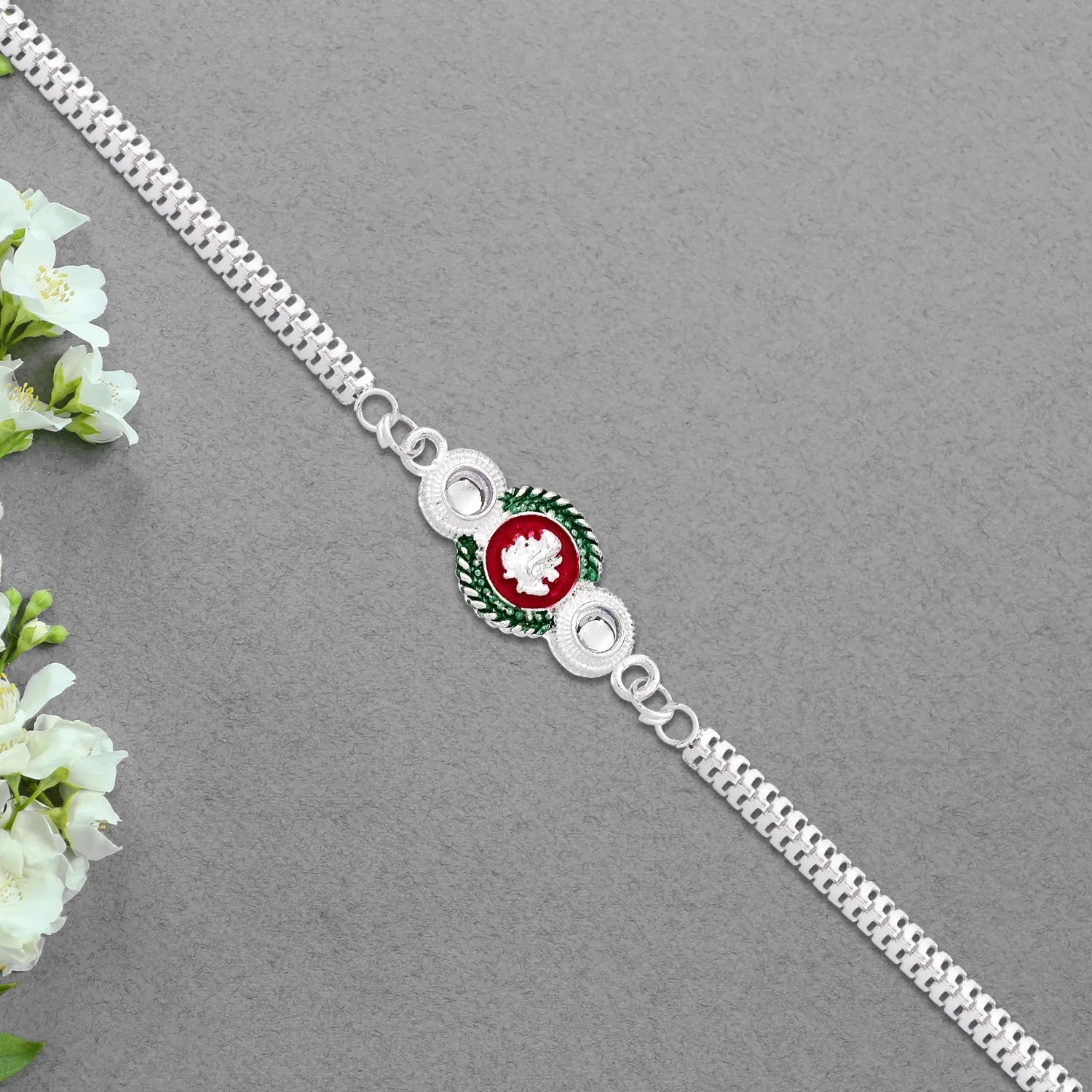 Shiny Silver Rakhi With Ganesha Emblem And Elegant Dual Chain Design - Zidbik