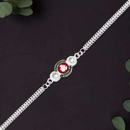 Shiny Silver Rakhi With Ganesha Emblem And Elegant Dual Chain Design - Zidbik