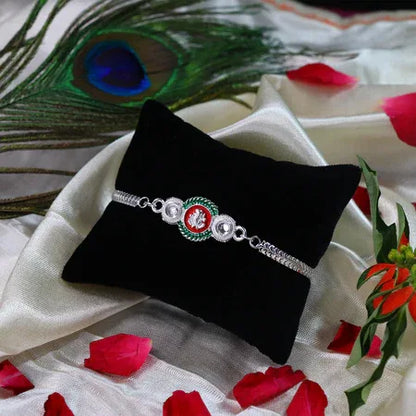 Shiny Silver Rakhi With Ganesha Emblem And Elegant Dual Chain Design - Zidbik